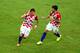 MANAUS, BRAZIL - JUNE 18: Mario Mandzukic of Croatia celebrates scoring his team's third goal during the 2014 FIFA World Cup Brazil Group A match between Cameroon and Croatia at Arena Amazonia on June 18, 2014 in Manaus, Brazil. (Photo by Stu Forster/Getty Images)