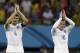 England's Steven Gerrard, left, and Wayne Rooney applaud spectators after the group D World Cup soccer match between England and Italy at the Arena da Amazonia in Manaus, Brazil, Saturday, June 14, 2014. Italy won the match 2-1. (AP Photo/Martin Mejia)