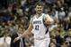 Minnesota Timberwolves' Kevin Love , left, congratulates Corey Brewer after Brewer's dunk in the first quarter of an NBA basketball game against the Detroit Pistons, Friday, March 7, 2014, in Minneapolis. (AP Photo/Jim Mone)
