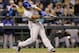 Texas Rangers' Adrian Beltre drives in a run on a fielder's choice against the Seattle Mariners in the ninth inning of a baseball game Friday, June 13, 2014, in Seattle. (AP Photo/Elaine Thompson)
