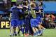 Italian players celebrate after the group D World Cup soccer match between England and Italy at the Arena da Amazonia in Manaus, Brazil, Saturday, June 14, 2014. Italy won the match 2-1. (AP Photo/Matt Dunham)