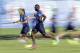 Italy's player Mario Balotelli sprints during his team's training session in Mangaratiba, Brazil, Wednesday, June 18, 2014. Balotelli marked his first World Cup game by scoring the winner for Italy against England. (AP Photo/Antonio Calanni)