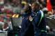 Tottenham Hotspur's assistant coachs Chris Ramsey, left, and Les Ferdinand watch from the sideline during their Europa League round of 16, second leg, soccer match with Benfica Thursday, March 20, 2014, at Benfica's Luz stadium. (AP Photo / Armando Franca)