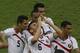 Costa Rica's Oscar Duarte, center, celebrates with teammates his side's 2nd goal during the group D World Cup soccer match between Uruguay and Costa Rica at the Arena Castelao in Fortaleza, Brazil, Saturday, June 14, 2014. (AP Photo/Sergei Grits)