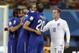England's Wayne Rooney, right, looks on as Italy's Gabriel Paletta, center, and other Italian players celebrate after the group D World Cup soccer match between England and Italy at the Arena da Amazonia in Manaus, Brazil, Saturday, June 14, 2014. Italy won the match 2-1. (AP Photo/Martin Mejia)