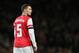 Arsenal's Thomas Vermaelen looks to his right as he watches his teammates during their English League Cup soccer match between Arsenal and Chelsea at the Emirates stadium in London Tuesday, Oct. 29, 2013. (AP Photo/Alastair Grant)