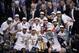 The San Antonio Spurs pose for a photo after Game 5 of the NBA basketball finals against the Miami Heat on Sunday, June 15, 2014, in San Antonio. The Spurs won the NBA championship 104-87. (AP Photo/Tony Gutierrez)