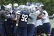 Dallas Cowboys mix it up as rookie guard Zach Martin, right, is held back during an NFL football minicamp Wednesday, June 18, 2014, in Irving, Texas. (AP Photo/LM Otero)