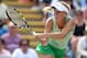 EASTBOURNE, ENGLAND - JUNE 19: Caroline Wozniacki of Denmark returns against Camila Giorgi of Italy during their singles match on day six of the Aegon International at Devonshire Park on June 19, 2014 in Eastbourne, England. (Photo by Jan Kruger/Getty Images)