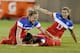 United States' Amy Rodriguez, left, and Tobin Heath, right, congratulate Alex Morgan, center, on her goal during the second half of a women's friendly soccer match against France, Thursday, June 19, 2014, in East Hartford, Conn. The final score was 2-2. (AP Photo/Jessica Hill)