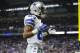Dallas Cowboys wide receiver Terrance Williams (83) reacts after he scores a touchdown against the Detroit Lions during an NFL football game in Detroit, Sunday, Oct. 27, 2013. (AP Photo/Rick Osentoski)