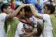 Costa Rica's Bryan Ruiz, center, is congratulated by teammates after scoring his side's first goal over Italy's goalkeeper Gianluigi Buffon during the group D World Cup soccer match between Italy and Costa Rica at the Arena Pernambuco in Recife, Brazil, Friday, June 20, 2014. (AP Photo/Ricardo Mazalan)