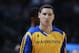 Golden State Warriors guard Klay Thomspon warms up before facing the Denver Nuggets in the first quarter of an NBA basketball game in Denver on Monday, Dec. 23, 2013. (AP Photo/David Zalubowski)