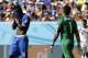 Italy's Mario Balotelli, left, wipes his face in front of Costa Rica's goalkeeper Keylor Navas during the group D World Cup soccer match between Italy and Costa Rica at the Arena Pernambuco in Recife, Brazil, Friday, June 20, 2014. (AP Photo/Ricardo Mazalan)
