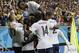 French players celebrate after France's Karim Benzema, left, scored his side's fourth goal during the group E World Cup soccer match between Switzerland and France at the Arena Fonte Nova in Salvador, Brazil, Friday, June 20, 2014. (AP Photo/Christophe Ena)