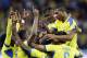 Ecuador's Enner Valencia, center, celebrates with teammates after scoring his team's second goal during the group E World Cup soccer match between Honduras and Ecuador at the Arena da Baixada in Curitiba, Brazil, Friday, June 20, 2014. (AP Photo/Michael Sohn)