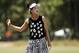 Lucy Li reacts after her approach shot on the second hole during the second round of the U.S. Women's Open golf tournament in Pinehurst, N.C., Friday, June 20, 2014. (AP Photo/Chuck Burton)