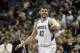 Minnesota Timberwolves' Kevin Love , left, congratulates Corey Brewer after Brewer's dunk in the first quarter of an NBA basketball game against the Detroit Pistons, Friday, March 7, 2014, in Minneapolis. (AP Photo/Jim Mone)