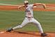 Texas' Nathan Thornhill (36) throws against Houston in the third inning of an NCAA college baseball tournament super regional game in Austin, Texas, Friday, June 6, 2014. (AP Photo/Michael Thomas)