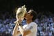 Andy Murray of Britain poses with the trophy after defeating Novak Djokovic of Serbia during the Men's singles final match at the All England Lawn Tennis Championships in Wimbledon, London, Sunday, July 7, 2013. (AP Photo/Kirsty Wigglesworth)