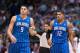 Oct 14, 2013; Dallas, TX, USA; Orlando Magic center Nikola Vucevic (9) and small forward Tobias Harris (12) and Dallas Mavericks small forward Jae Crowder (9) wait for play to resume during the game at the American Airlines Center. The Magic defeated the Mavericks 102-94. Mandatory Credit: Jerome Miron-USA TODAY Sports