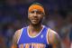New York Knicks' Carmelo Anthony reacts to an official's call during the second half of an NBA basketball game against the Phoenix Suns, Friday, March 28, 2014, in Phoenix. The Suns won 112-88. (AP Photo/Matt York)