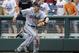 Virginia first baseman Mike Papi, center, reacts after catching a foul ball hit to the stands by Mississippi's Will Allen to end the fifth inning of an NCAA College World Series baseball game in Omaha, Neb., Saturday, June 21, 2014. (AP Photo/Eric Francis)
