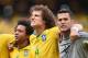 FORTALEZA, BRAZIL - JUNE 17: David Luiz of Brazil (center) sings the National Anthem with Marcelo and Julio Cesar before the 2014 FIFA World Cup Brazil Group A match between Brazil and Mexico at Castelao on June 17, 2014 in Fortaleza, Brazil. (Photo by Laurence Griffiths/Getty Images)