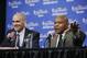 Dallas Mavericks head coach Rick Carlisle smiles as Bernie Bickerstaff, who had just received the 2014 Chuck Daly Lifetime Achievement Award, answers a question before Game 1 of the NBA basketball finals between the San Antonio Spurs and the Miami Heat on Thursday, June 5, 2014, in San Antonio. Bickerstaff is currently an assistant coach with the Cleveland Cavaliers. (AP Photo/Tony Gutierrez)