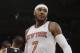 New York Knicks' Carmelo Anthony (7) reacts after scoring during the first half of an NBA basketball game against the Brooklyn Nets Wednesday, April 2, 2014, in New York. (AP Photo/Frank Franklin II)
