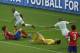 Algeria's Yacine Brahimi, back left, turns away as he celebrates scoring his side's fourth goal as South Korea's goalkeeper Jung Sung-ryong lies on the grond, centre, during the group H World Cup soccer match between South Korea and Algeria at the Estadio Beira-Rio in Porto Alegre, Brazil, Sunday, June 22, 2014. (AP Photo/Michael Sohn)