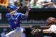Toronto Blue Jays' Jose Bautista, left, watches his double in the first inning of a baseball game against the Baltimore Orioles, Sunday, June 15, 2014, in Baltimore. Blue Jays' Jose Reyes scored on the play. (AP Photo/Patrick Semansky)