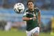 Mexico's Javier Hernandez chases the ball in downpour during the group A World Cup soccer match between Mexico and Cameroon in the Arena das Dunas in Natal, Brazil, Friday, June 13, 2014. Mexico defeated Cameroon 1-0. (AP Photo/Petr David Josek)