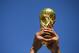 SAO PAULO, BRAZIL - JUNE 23: A fan holds up a replica of the World Cup trophy prior to the 2014 FIFA World Cup Brazil Group B match between the Netherlands and Chile at Arena de Sao Paulo on June 23, 2014 in Sao Paulo, Brazil. (Photo by Julian Finney/Getty Images)