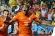 Netherlands' Leroy Fer celebrates scoring the opening goal during the group B World Cup soccer match between the Netherlands and Chile at the Itaquerao Stadium in Sao Paulo, Brazil, Monday, June 23, 2014. (AP Photo/Frank Augstein)