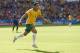 Australia's Tim Cahill celebrates after scoring his side's first goal during the group B World Cup soccer match between Australia and the Netherlands at the Estadio Beira-Rio in Porto Alegre, Brazil, Wednesday, June 18, 2014. (AP Photo/Wong Maye-E)