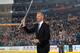 BUFFALO, NY - MARCH 29: Former Buffalo Sabres goaltender Dominik Hasek flashes his saber to an appreciative crowd after being the 42nd member inducted into the Buffalo Sabres Hall of Fame prior to the game against the Tampa Bay Lightning on March 29, 2014 at the First Niagara Center in Buffalo, New York. (Photo by Bill Wippert/NHLI via Getty Images)