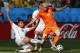 Chile's Gonzalo Jara, left, and Netherlands' Arjen Robben challenge for the ball during the group B World Cup soccer match between the Netherlands and Chile at the Itaquerao Stadium in Sao Paulo, Brazil, Monday, June 23, 2014. (AP Photo/Frank Augstein)