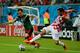 RECIFE, BRAZIL - JUNE 23: Andres Guardado of Mexico and Darijo Srna of Croatia compete for the ball during the 2014 FIFA World Cup Brazil Group A match between Croatia and Mexico at Arena Pernambuco on June 23, 2014 in Recife, Brazil. (Photo by Jamie McDonald/Getty Images)