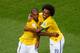 Brazil celebrate scoring their fourth goal in the 4-1 win over Cameroon.