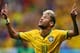 BRASILIA, BRAZIL - JUNE 23: Neymar of Brazil celebrates scoring his team's second goal and his second of the game during the 2014 FIFA World Cup Brazil Group A match between Cameroon and Brazil at Estadio Nacional on June 23, 2014 in Brasilia, Brazil. (Photo by Clive Brunskill/Getty Images)