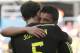 Spain's David Villa, right, embraces Spain's Juanfran after scoring the opening goal during the group B World Cup soccer match between Australia and Spain at the Arena da Baixada in Curitiba, Brazil, Monday, June 23, 2014. (AP Photo/Jon Super)