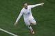 England's Wayne Rooney celebrates scoring his side's first goal during the group D World Cup soccer match between Uruguay and England at the Itaquerao Stadium in Sao Paulo, Brazil, Thursday, June 19, 2014. (AP Photo/Michael Sohn)