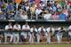Virginia players watch from the bench in the third inning of the opening game of the best-of-three NCAA baseball College World Series finals against Vanderbilt in Omaha, Neb., Monday, June 23, 2014. (AP Photo/Ted Kirk)