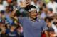 Mar 25, 2014; Miami, FL, USA; Roger Federer waves to the crowd after his match against Richard Gasquet (not pictured) on day nine of the Sony Open at Crandon Tennis Center. Federer won 6-1, 6-2. Mandatory Credit: Geoff Burke-USA TODAY Sports