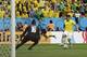 Brazil's Hulk attacks Cameroon's goalkeeper Charles Itandje's goal during the group A World Cup soccer match between Cameroon and Brazil at the Estadio Nacional in Brasilia, Brazil, Monday, June 23, 2014. (AP Photo/Natacha Pisarenko)