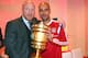 In this picture taken Saturday May 17, 2014, Bayern Munich's coach Pep Guardiola, right, holds the German soccer cup with sporting director Matthias Sammer during the after-match party after the club won the German soccer cup final against Borussia Dortmund in Berlin. (AP Photo/ Alexander Hassenstein,Pool)