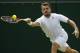 Stan Wawrinka of Switzerland plays a return to Joao Sousa of Portugal during their first round match at the All England Lawn Tennis Championships in Wimbledon, London, Tuesday, June 24, 2014. (AP Photo/Alastair Grant)