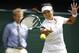 Li Na of China plays a return to Paula Kania of Poland during their first round match at the All England Lawn Tennis Championships in Wimbledon, London, Monday, June 23, 2014. (AP Photo/Pavel Golovkin)