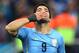 SAO PAULO, BRAZIL - JUNE 19: Luis Suarez of Uruguay gestures during the 2014 FIFA World Cup Brazil Group D match between Uruguay and England at Arena de Sao Paulo on June 19, 2014 in Sao Paulo, Brazil. (Photo by Julian Finney/Getty Images)